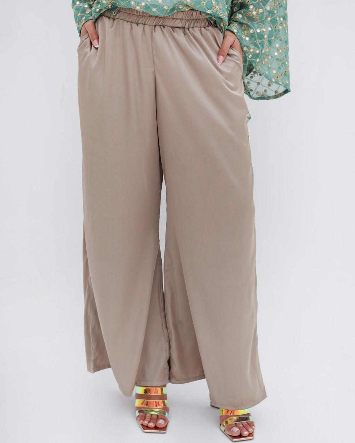 Satin pants in cafe